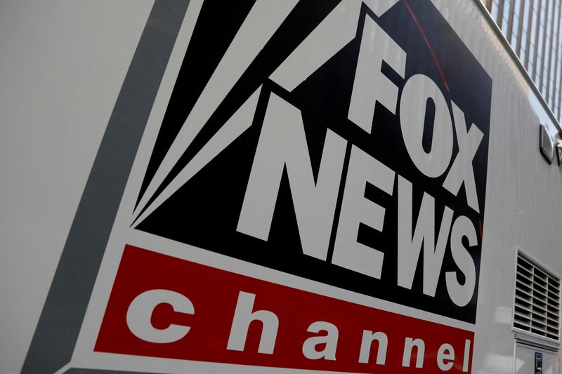 FILE PHOTO: A Fox News channel sign is seen on a television vehicle outside the News Corporation building in New York City, in New York