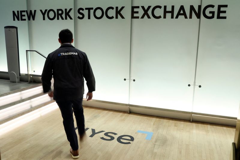 FILE PHOTO: A trader enters the floor of the New York Stock Exchange