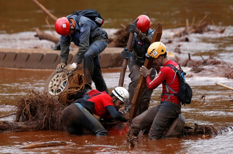 FILE PHOTO: Members of a rescue team search for victims of a collapsed tailings dam owned by Brazilian mining company Vale SA in a vehicle on Paraopeba River, in Brumadinho