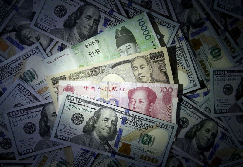 FILE PHOTO: Illustration of South Korean won, Chinese yuan and Japanese yen notes seen on U.S. $100 notes
