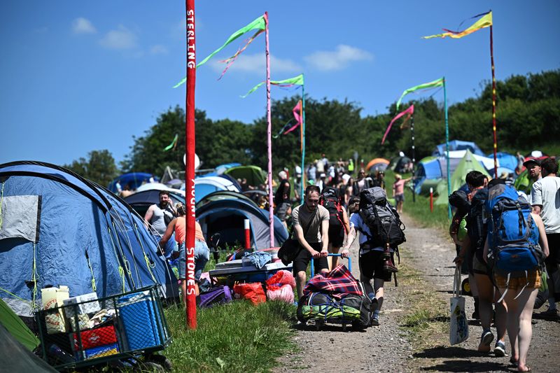 Revellers arrive at Worthy Farm in Somerset during the Glastonbury Festival