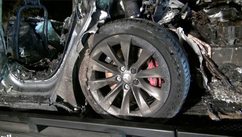 FILE PHOTO: The remains of a Tesla vehicle are seen after it crashed in The Woodlands, Texas
