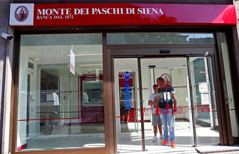 FILE PHOTO: People are seen inside a Monte dei Paschi di Siena bank in Rome