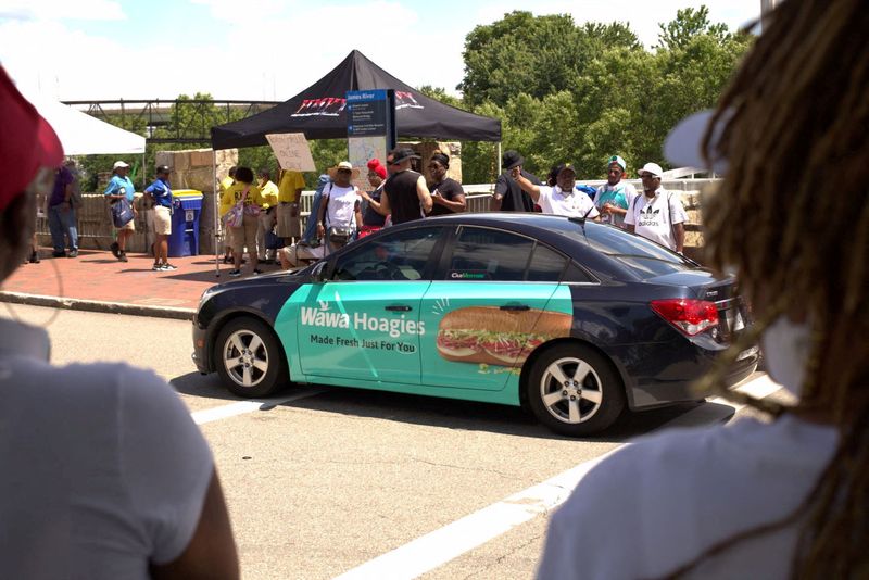 FILE PHOTO: A rideshare car with ads wrapped by mobile advertisement company Carvertise, in Richmond