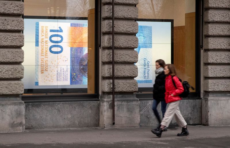 A projection shows a 100 franc banknote in a window in Zurich