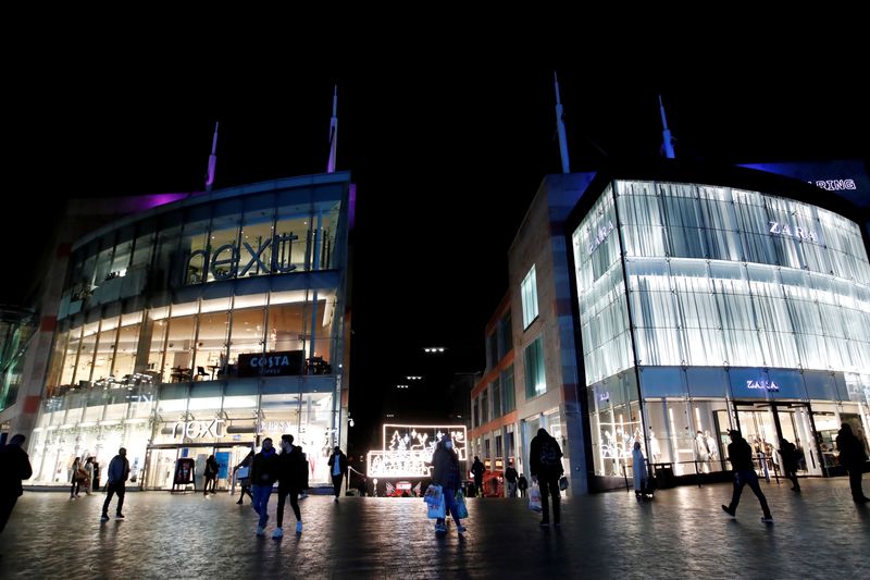 FILE PHOTO: Shoppers are seen walking near Bullring shopping centre, owned by mall operator Hammerson, in Birmingham