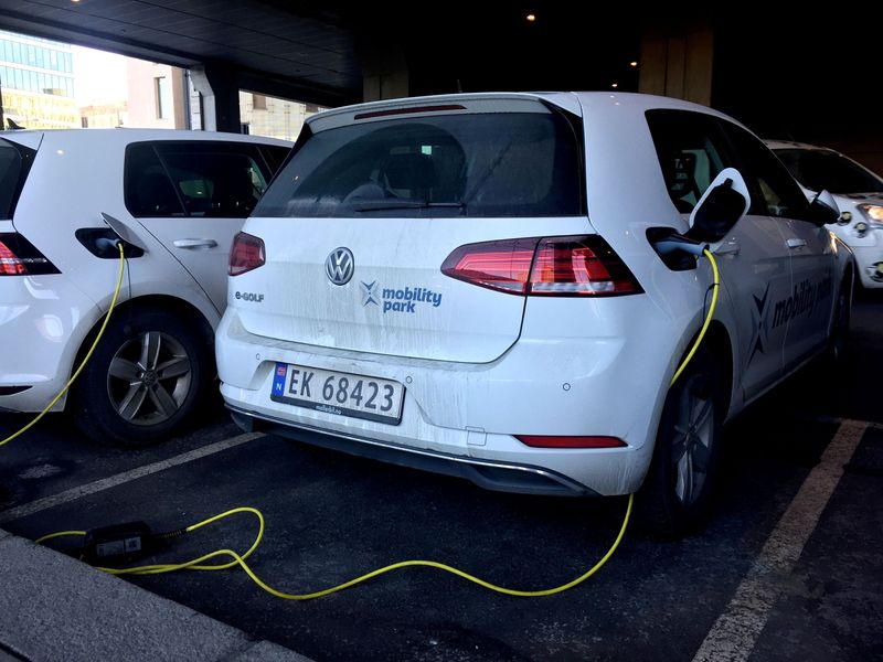 FILE PHOTO: Electric cars are parked in Oslo