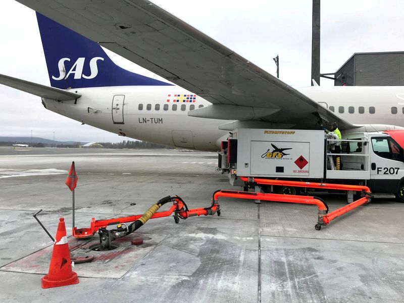 FILE PHOTO: A Scandinavian Airlines (SAS) plane is refuelled at Oslo Gardermoen airport