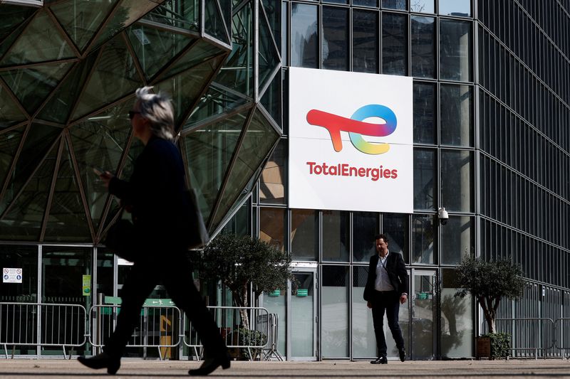 FILE PHOTO: The TotalEnergies logo sits on the company's headquarter skyscraper in the La Defense business district in Paris