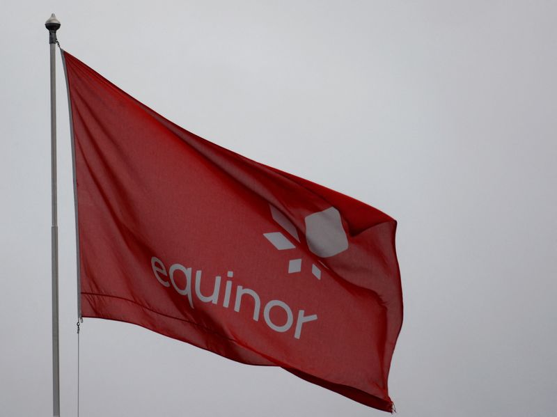FILE PHOTO: An Equinor flag flutters at the Norwegian oil company's Stavanger headquarters