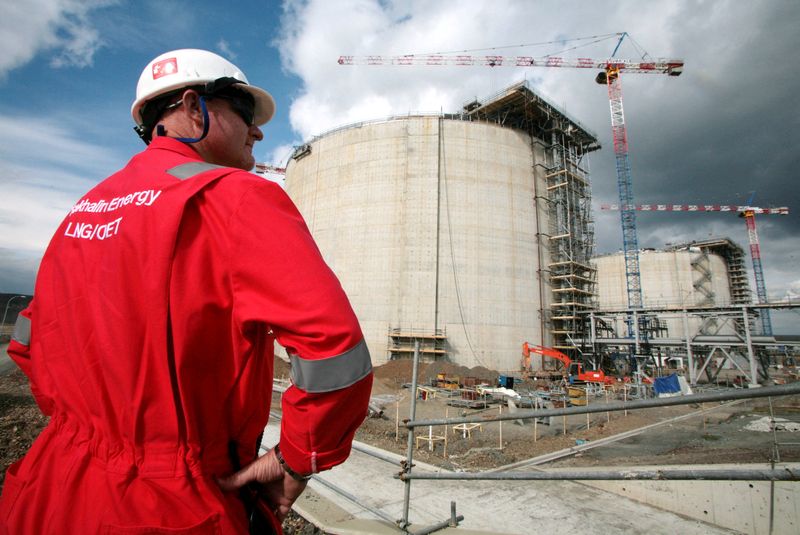 FILE PHOTO: FILE PHOTO: FILE PHOTO: An employee of Sakhalin Energy stands at the Sakhalin-2 project's liquefaction gas plant in Prigorodnoye