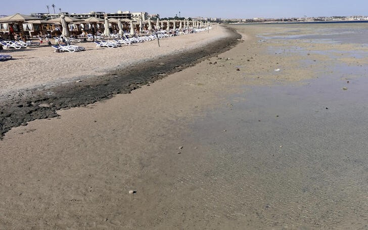 FILE PHOTO: Empty sunbeds are seen during a low tide at the beach of the Red Sea resort of Sahl Hasheesh, Hurghada