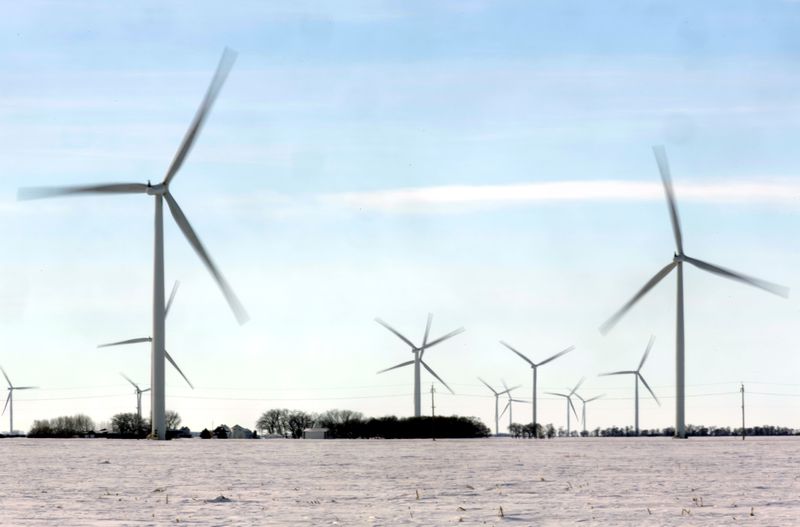 Wind turbines are seen in a field near Emerson