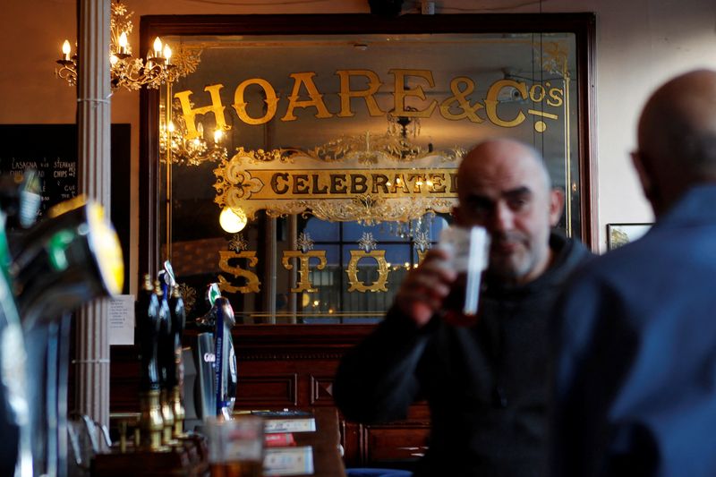 FILE PHOTO: Customers are seen inside the Little Driver pub in east London