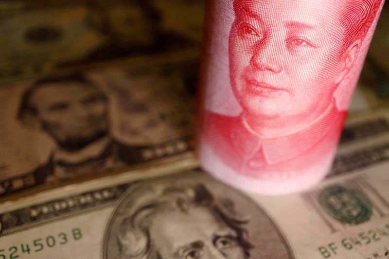 FILE PHOTO: Illustration picture of U.S. Dollar and Chinese Yuan banknotes