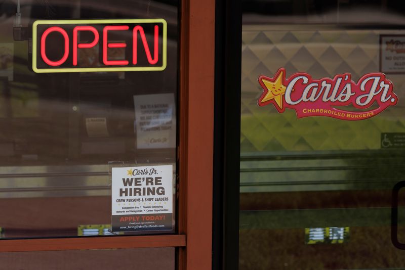 A help wanted sign is shown at a fast food restaurant in Solana Beach, California
