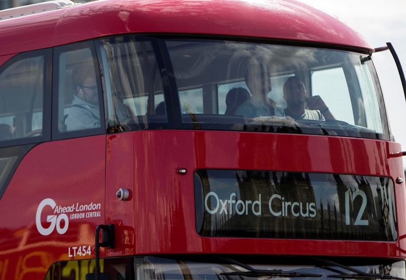 FILE PHOTO: A Go-Ahead bus crosses Westminster Bridge in London
