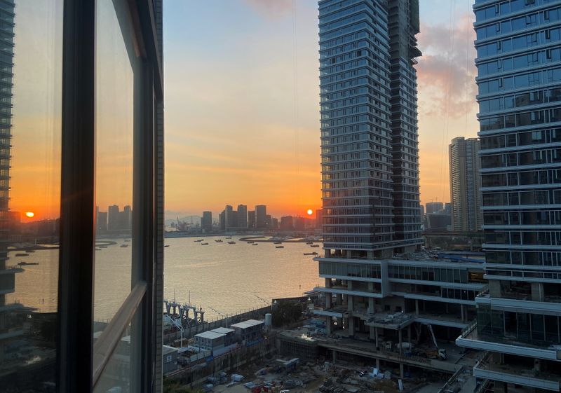 FILE PHOTO: Under-construction apartments are pictured from a building during sunset in the Shekou area of Shenzhen, Guangdong