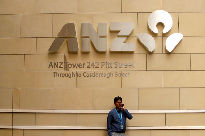 FILE PHOTO: A man talks on his phone in front of an ANZ Banking corporation tower in central Sydney