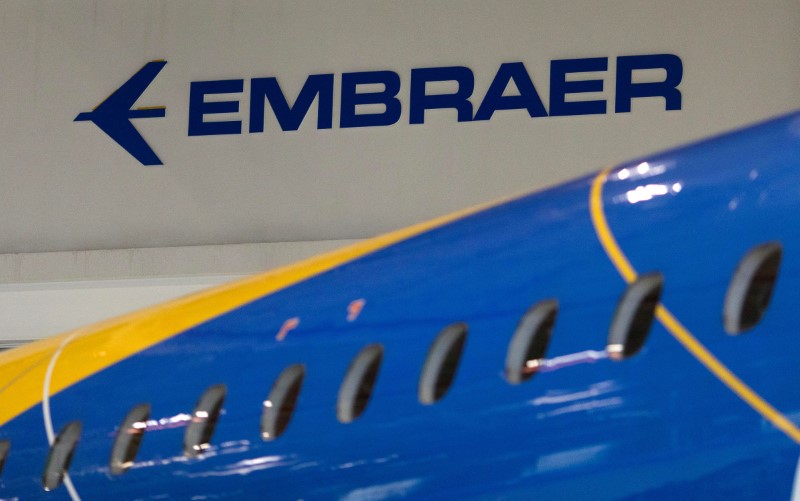 FILE PHOTO: The logo of Brazilian planemaker Embraer SA is seen at the company's headquarters in Sao Jose dos Campos