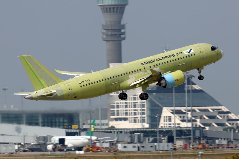 FILE PHOTO: The fifth prototype of China's home-built C919 passenger plane takes off for its first test flight from Shanghai Pudong International Airport in Shanghai