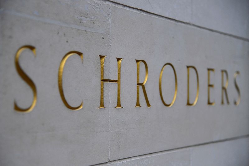 FILE PHOTO: FILE PHOTO: A Schroders sign is seen outside a building in the City of London, Britain