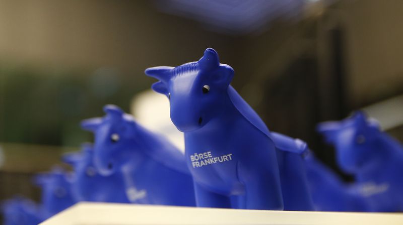 Styrofoam bull figures stand on a counter on the trading floor at the stock exchange in Frankfurt