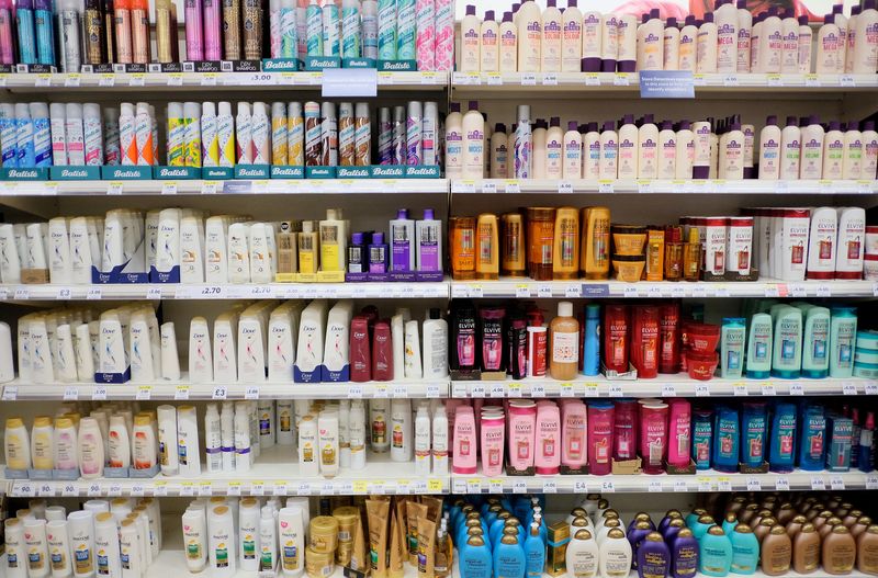 FILE PHOTO: Bottles of shampoos are displayed for sale on shelves at a Tesco supermarket in south London
