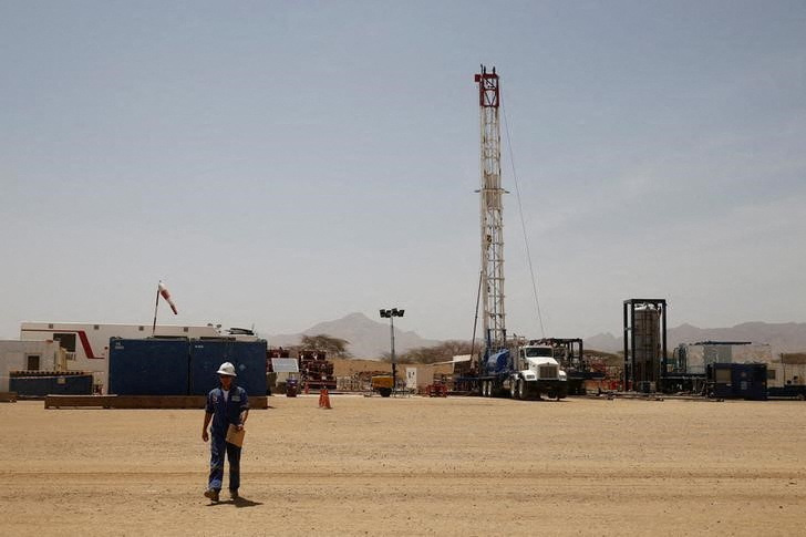 FILE PHOTO: Worker walks at a Tullow Oil explorational drilling site in Lokichar