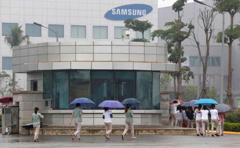 Employees make their way to work at the Samsung factory in Thai Nguyen province, north of Hanoi, Vietnam