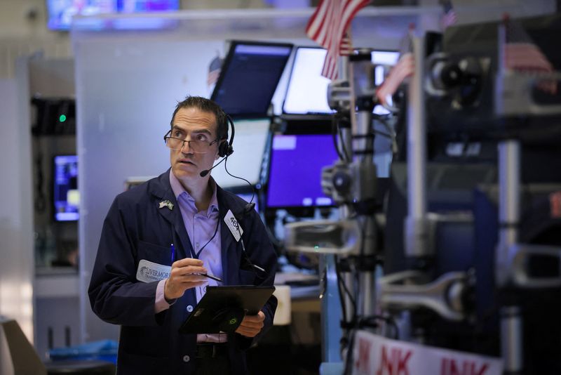 A trader works on the trading floor at the New York Stock Exchange (NYSE) in Manhattan, New York City