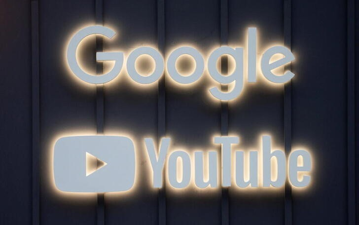 The logos of Google and YouTube are seen in Davos