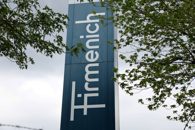 FILE PHOTO: A logo is pictured in front of flavour and fragrance maker Firmenich production site, in Meyrin