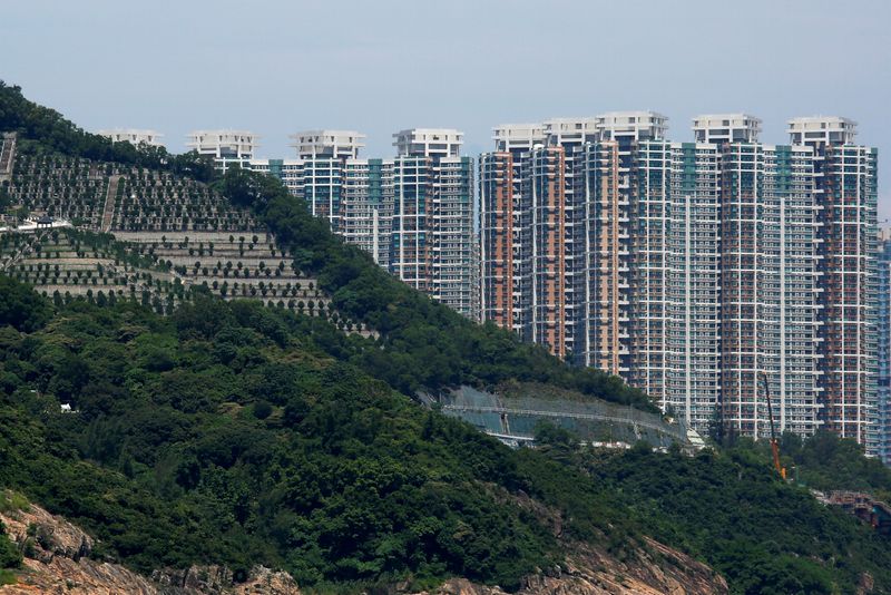 Private residential blocks are seen behind a cemetery in Hong Kong