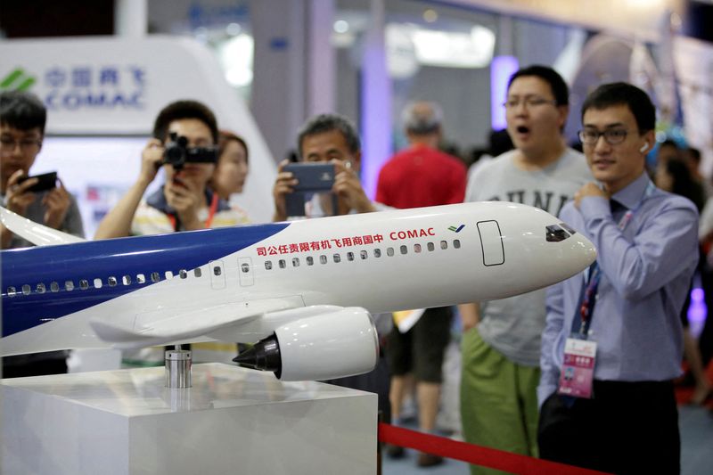 FILE PHOTO: A model of a C919 airliner by Commercial Aircraft Corp of China (COMAC) is displayed at China Beijing International High-tech Expo in Beijing