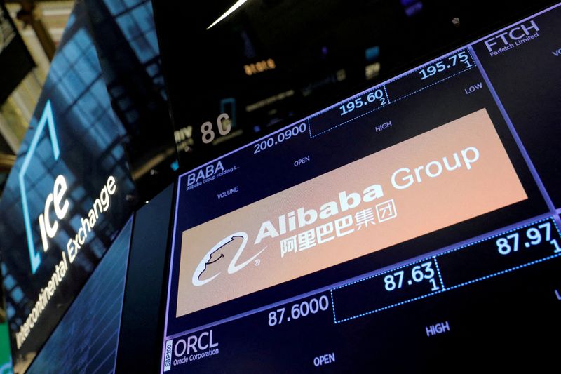 FILE PHOTO: The logo for Alibaba Group is seen on the trading floor at the New York Stock Exchange in Manhattan, New York City