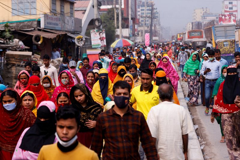 FILE PHOTO: Garments workers go back to their home to have lunch during lunch break Gazipur