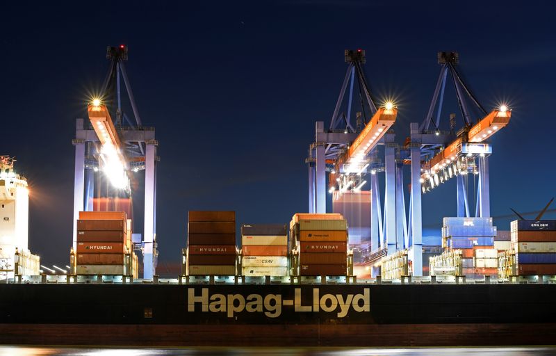 FILE PHOTO: A Hapag Lloyd container ship is loaded at the shipping terminal Altenwerder in the harbour of Hamburg
