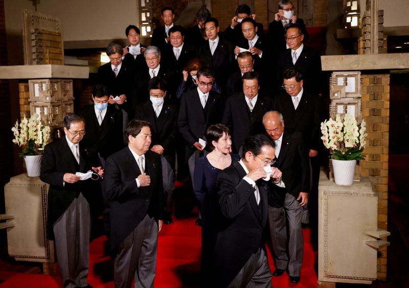 FILE PHOTO: Japan's Prime Minister Fumio Kishida and his cabinet ministers attend a photo session at Kishida's residence, in Tokyo