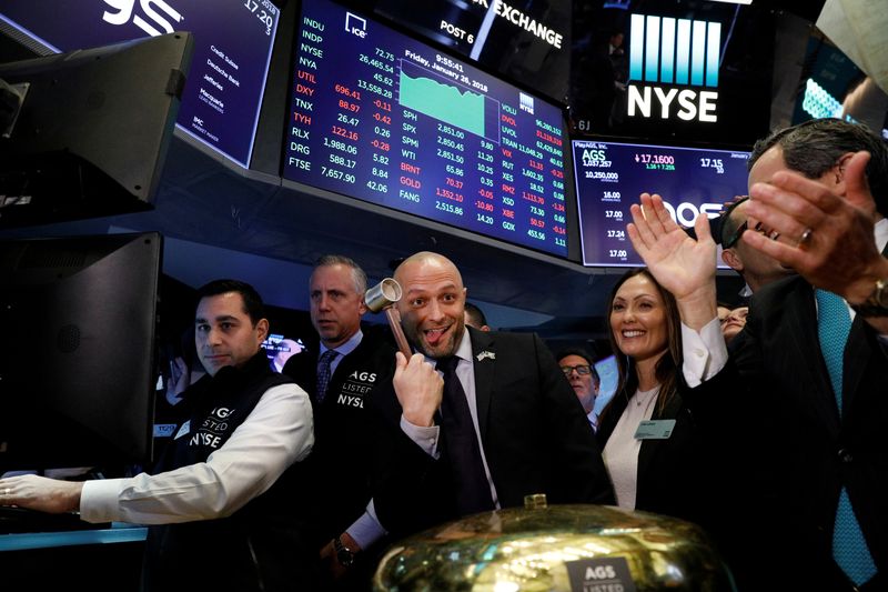 FILE PHOTO: PlayAGS, Inc.'s President and CEO David Lopez celebrates his company's IPO on the floor of the New York Stock Exchange in New York