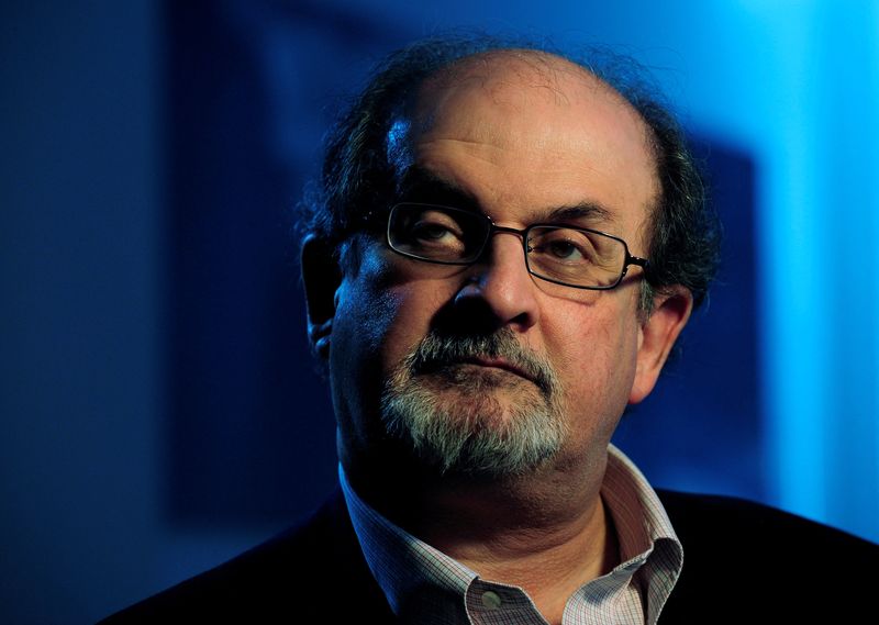 FILE PHOTO: British author Salman Rushdie listens during an interview with Reuters in London