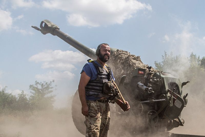 Ukrainian serviceman fires with a D-30 howitzer near a frontline in Mykolaiv region