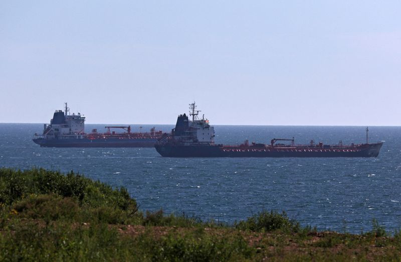 FILE PHOTO: Oil tankers sail along Nakhodka Bay near the port city of Nakhodka