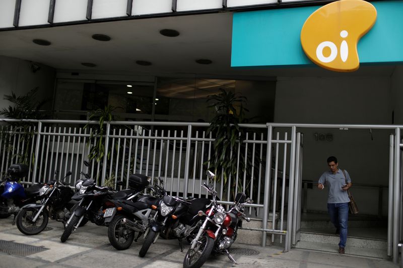 A man leaves the office of Brazilian telecoms company Oi SA in Rio de Janeiro