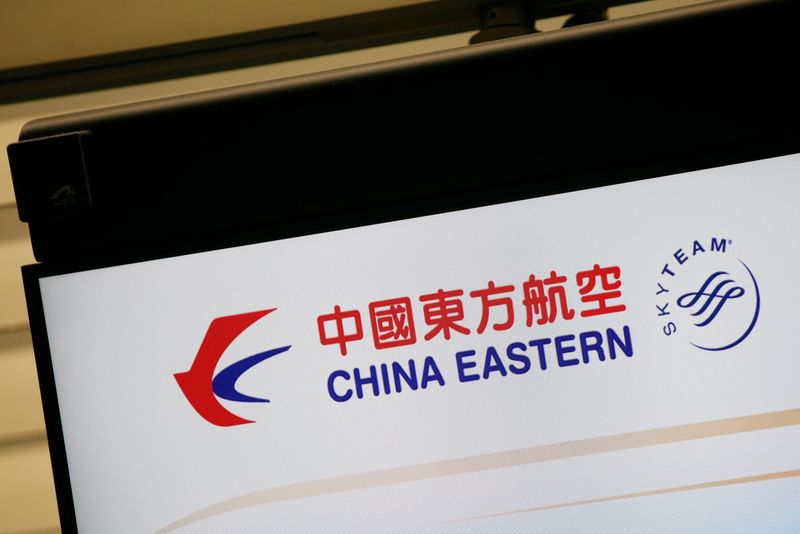 The logo of China Eastern Airlines is shown on a panel at a check-in counter at Hong Kong Airport in Hong Kong