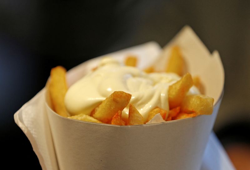 FILE PHOTO: A large cone of fries with mayonnaise sauce is pictured at the Maison Antoine frites stand in Brussels