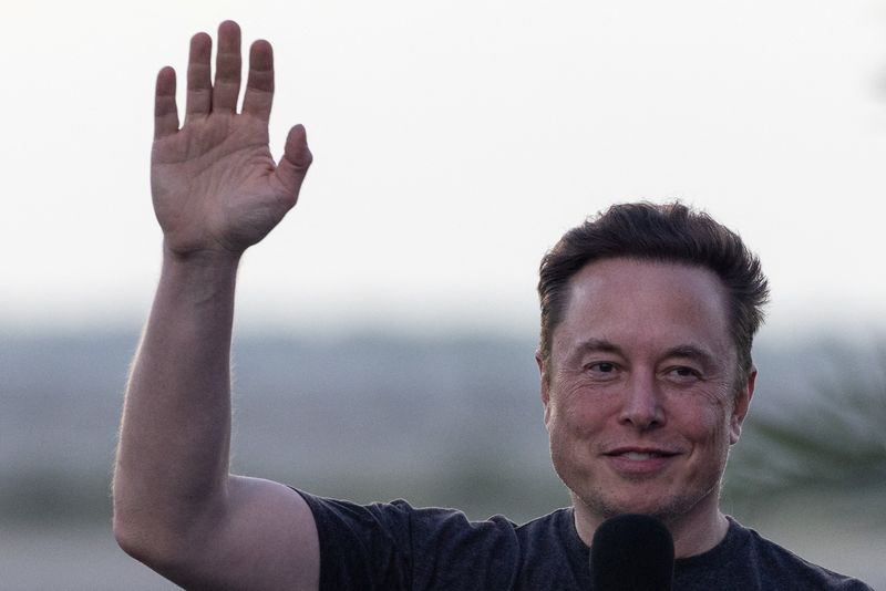 FILE PHOTO: Musk waves during news conference at SpaceX Starbase in Brownsville, Texas