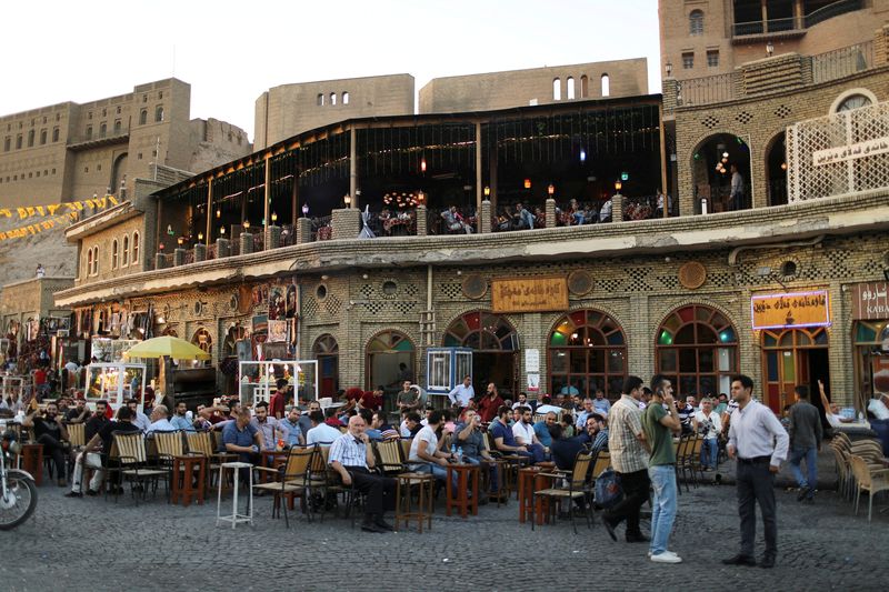FILE PHOTO: Kurdish people sit in a cafe in the old city of Erbil