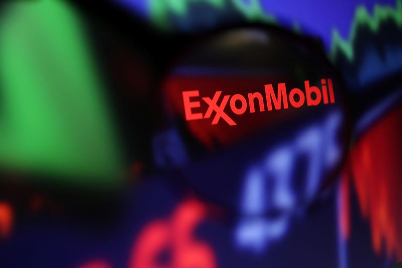 FILE PHOTO: Illustration shows Exxon Mobil logo and stock graph