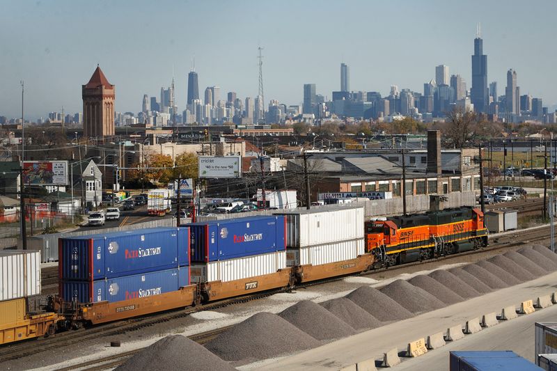 FILE PHOTO: Burlington Northern Santa Fe trains make their way through a rail yard in Chicago